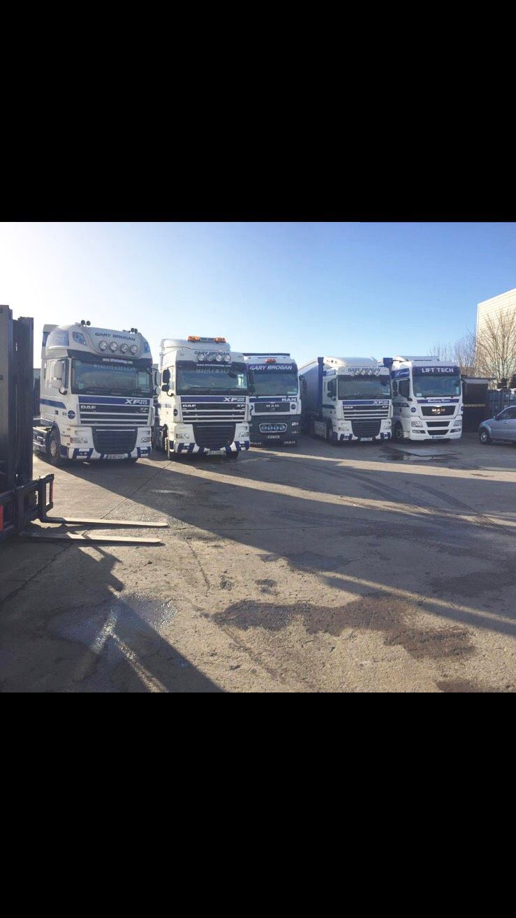 Line of trucks parked parallel to one another