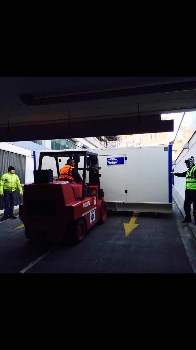 Forklift moving an electricity generator 