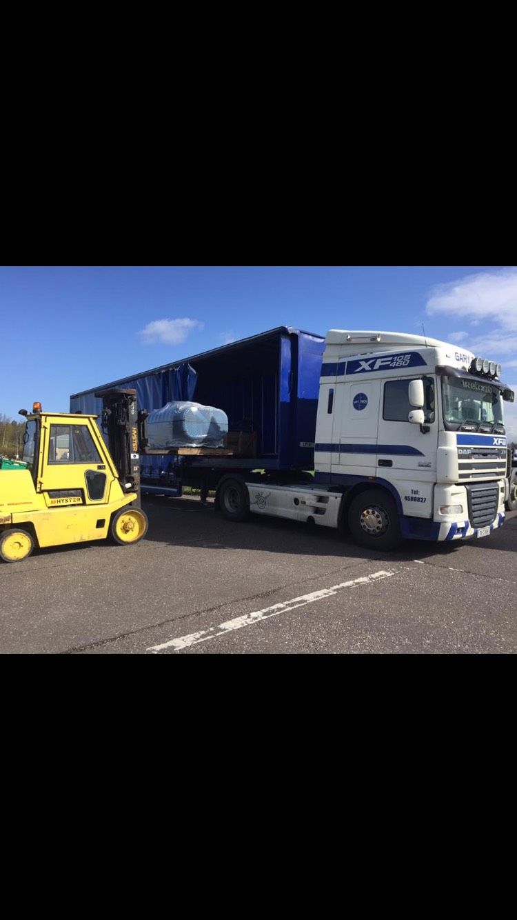 Yellow forklift loading a lorry