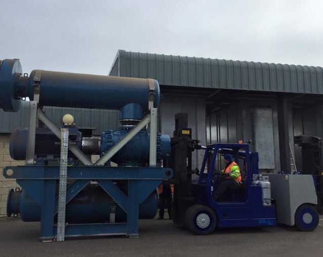 A forklift being loaded