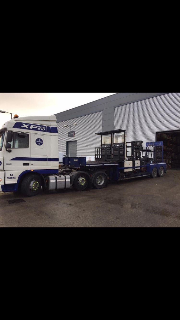 Lorry with its trailer being loaded