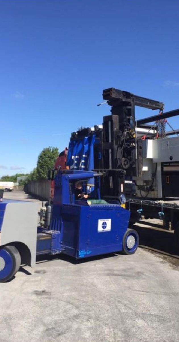 Blue Forklift loading equipment onto a lorry